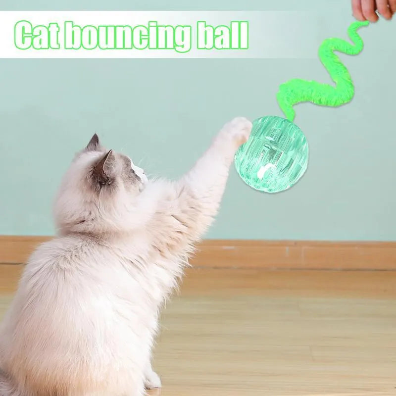 Interactive cat ball toy with bouncy TPR rubber core and removable plush tail, shown in green colour