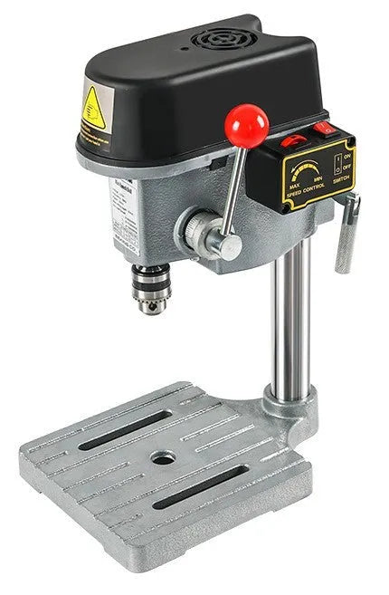 Bench drill and milling machine with cross bench pliers on workshop bench