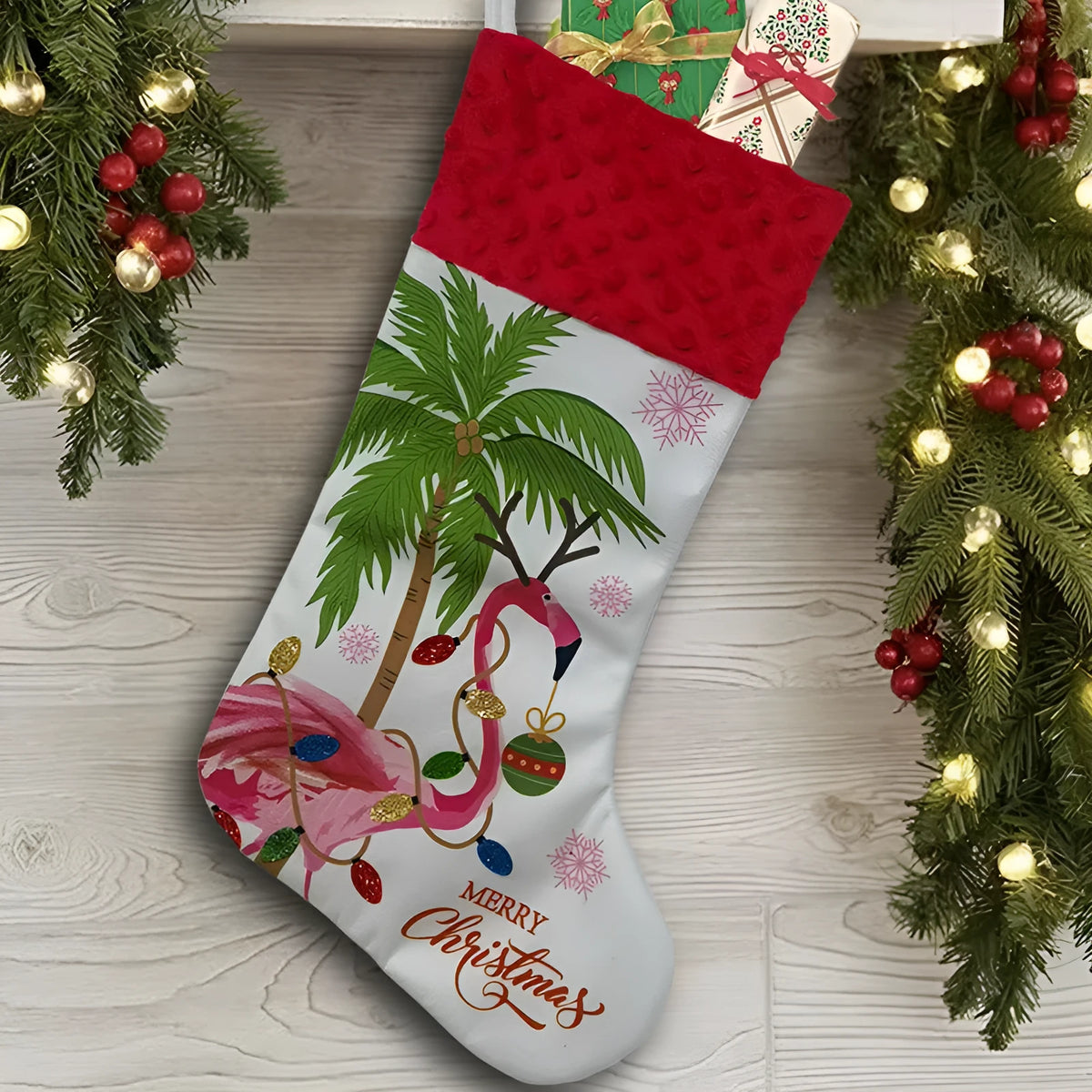 Flamingo Christmas stocking with decorative pendant measuring 46 by 28 centimetres
