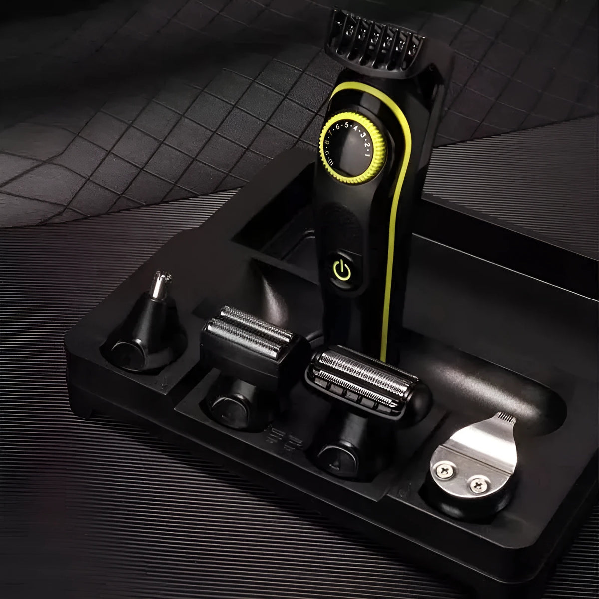 Black KM-696 rechargeable electric hair clipper with stainless steel blades and cleaning brush.