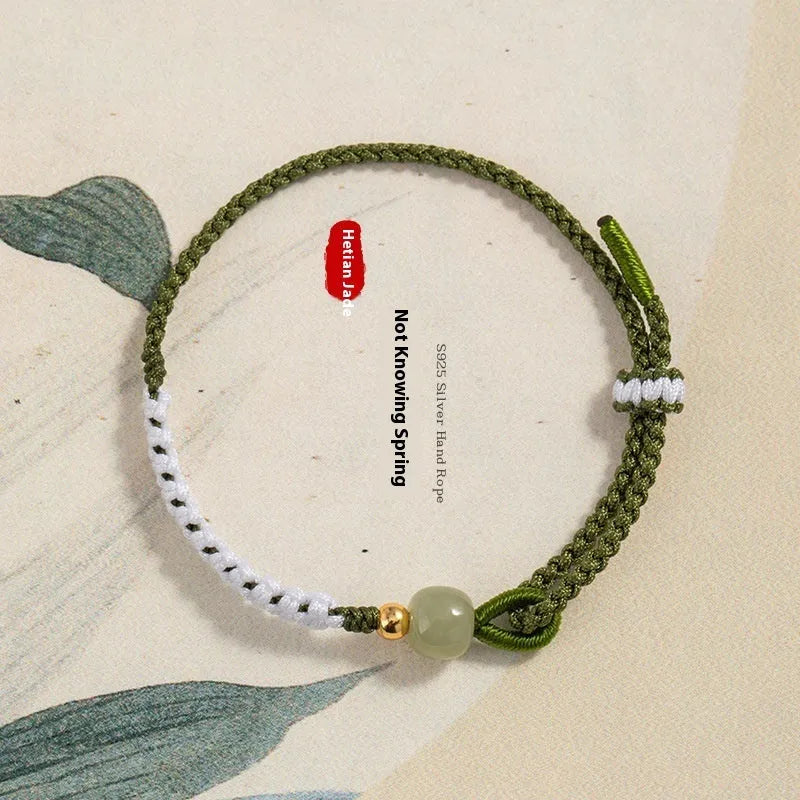 Hetian jade and sterling silver Chinese national bracelet on spring green cord carrying strap