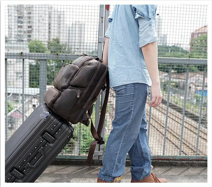 Dark brown retro crazy horse leather backpack for men with a 17-inch laptop compartment.