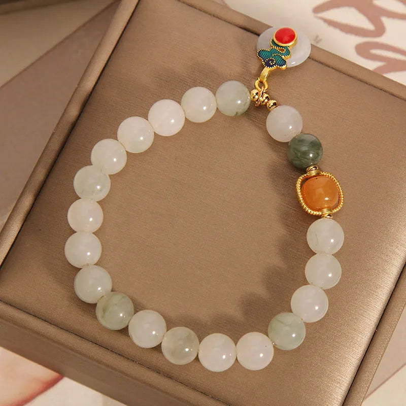 Women's ice jade bracelet with pearl detailing and traditional jade buckle