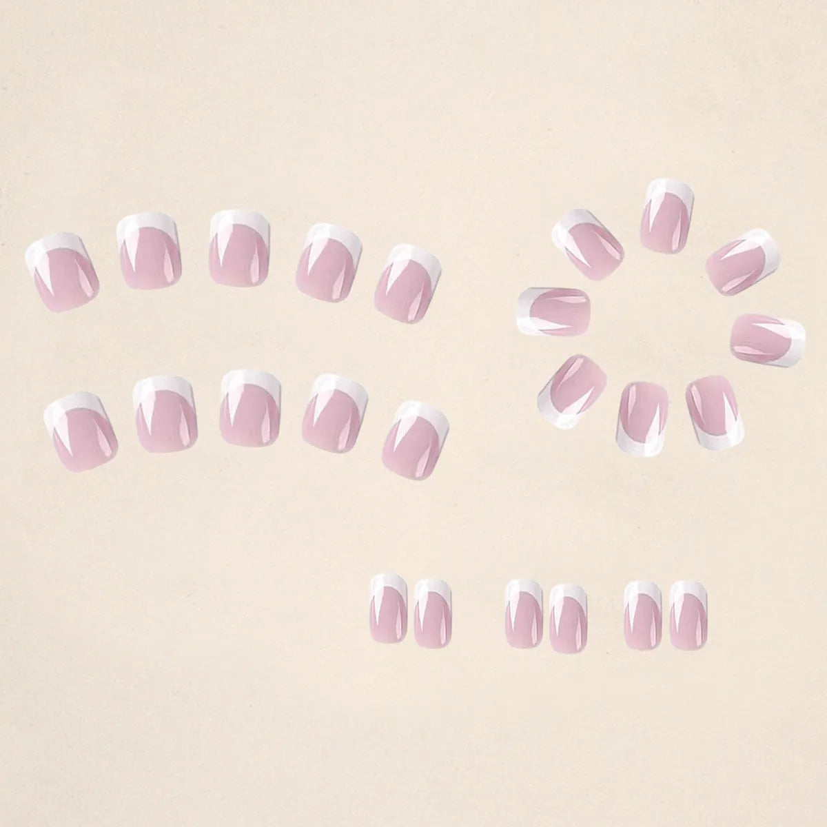 24 white plastic fake nails with a black and grey plaid pattern, arranged on a table.