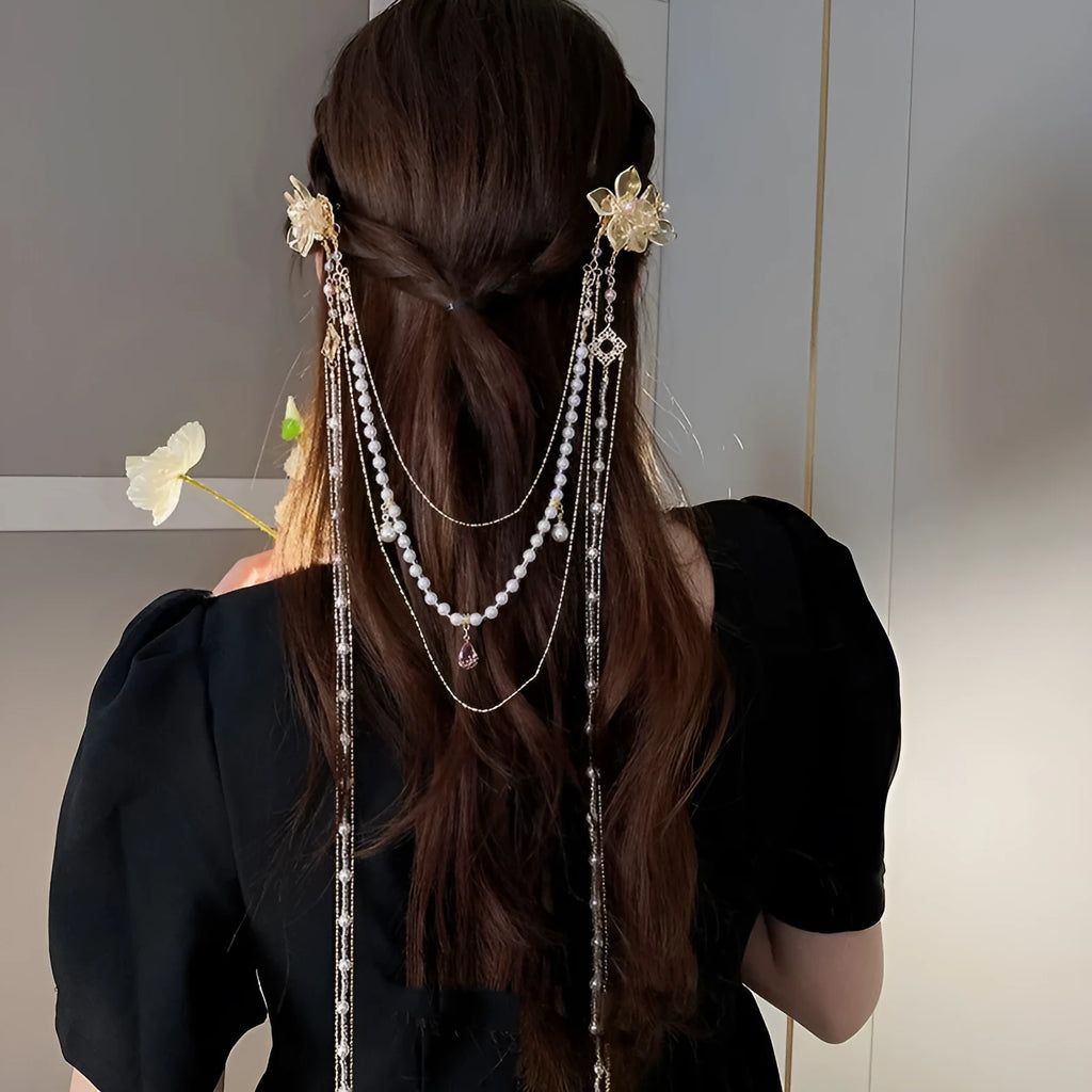 Gold women's hairpin with diamond grip and long tassel design