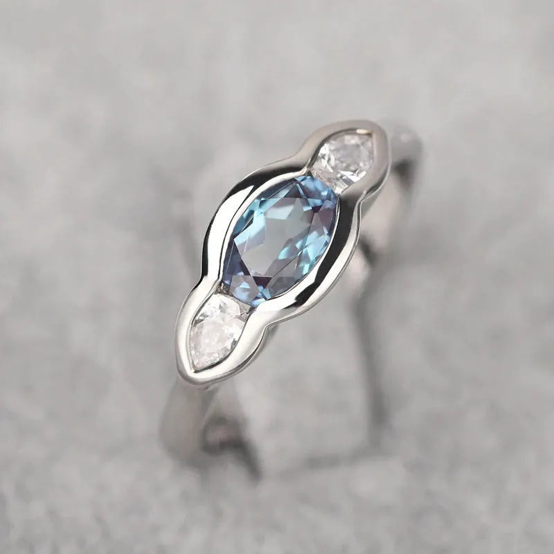 Geometric ellipse women's ring with zircon centre stone in white gold colour