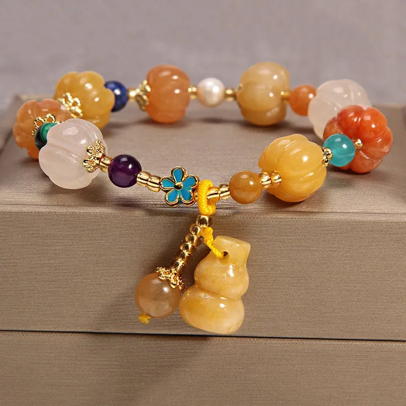 Women's yellow agate crystal bracelet on a gold silk cord, khaki colour.