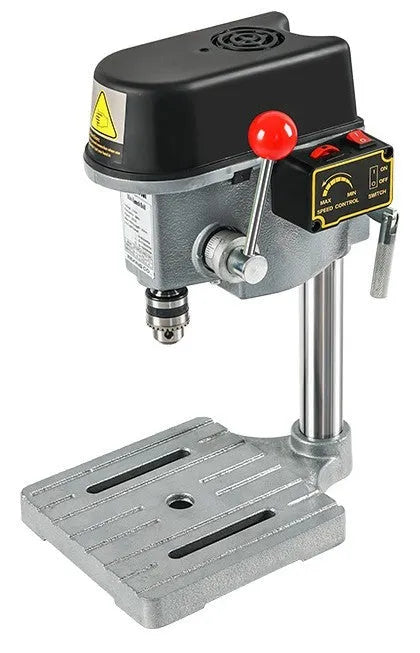 Bench drill and milling machine with cross bench pliers on workshop bench