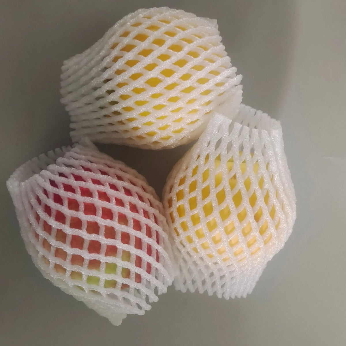 White foam net sleeve for protecting apples pears peaches and citrus fruit from bruising