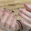 Glossy false nails with transparent pink French tip design showing 10 complete sets