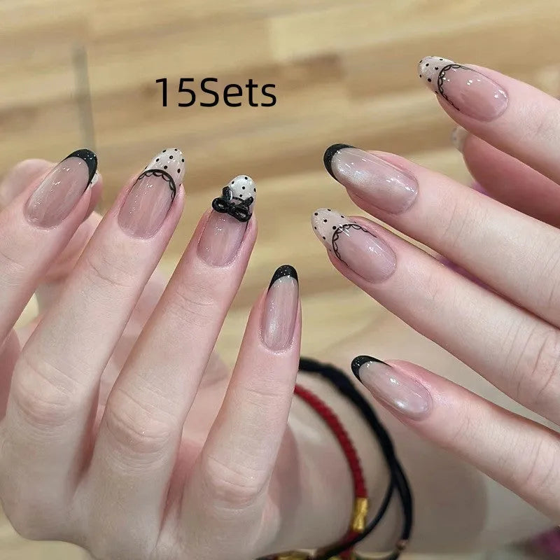 Glossy false nails with transparent pink French tip design showing 10 complete sets
