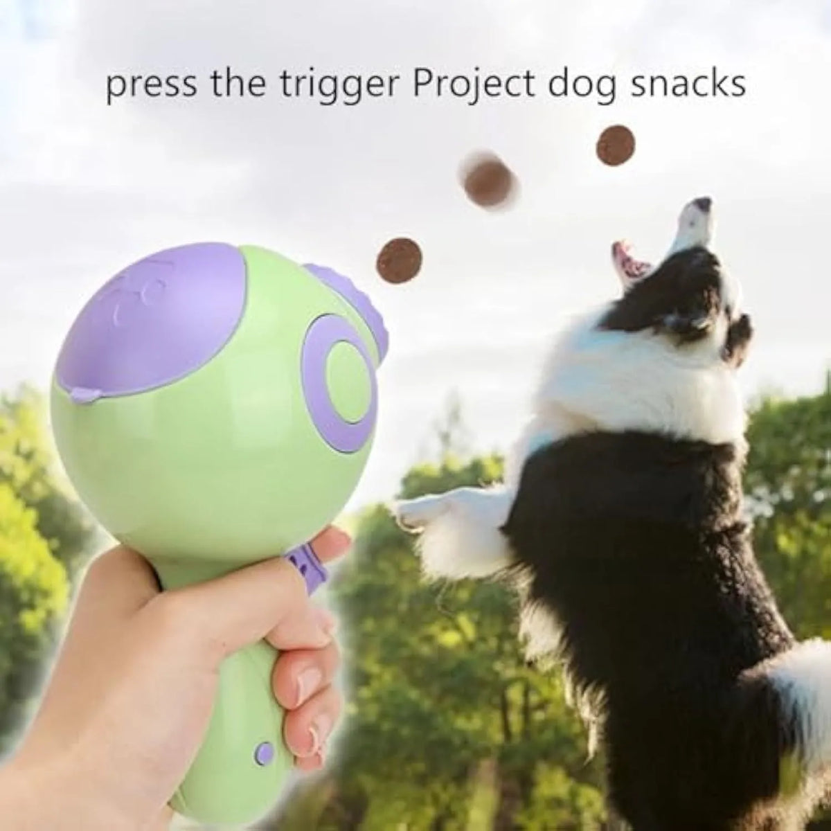 Green, orange, and pink dog treat launcher toy for remote feeding and interactive play