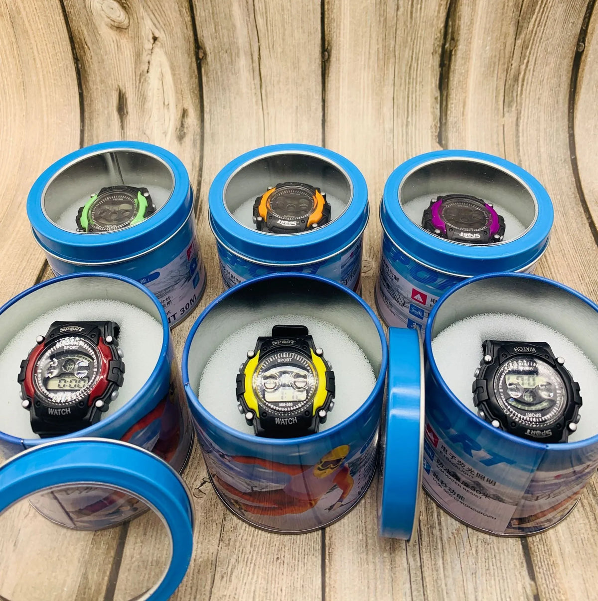 Digital sports watch for kids with mix colour plastic case and blue silicone strap on wrist