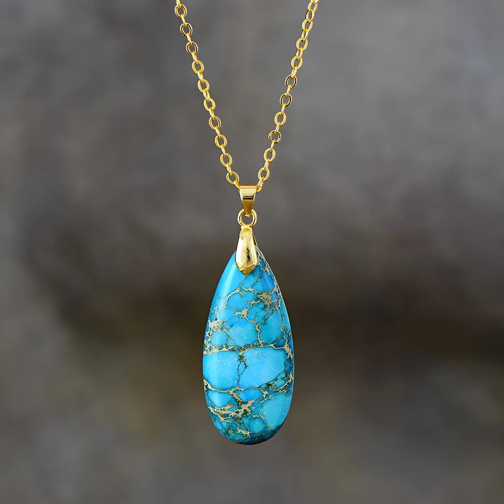 Water drop shaped emperor stone jade pendant on an 18K gold plated chain necklace.