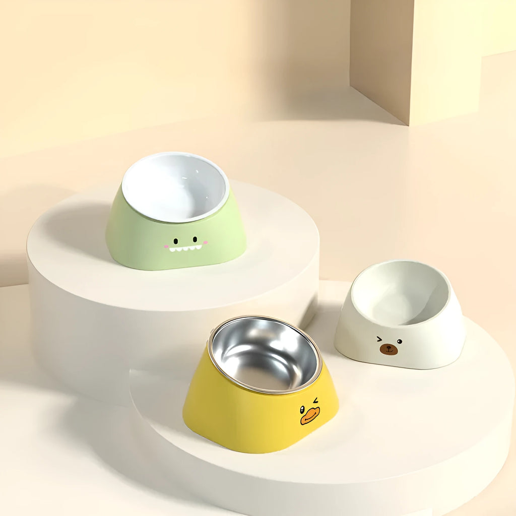 Green tilted stainless steel cat bowl with 15 degree angle on white PP plastic base