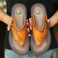 Men's dark blue herringbone-patterned outdoor slippers with a leather lining and rubber sole, shown in a large size.