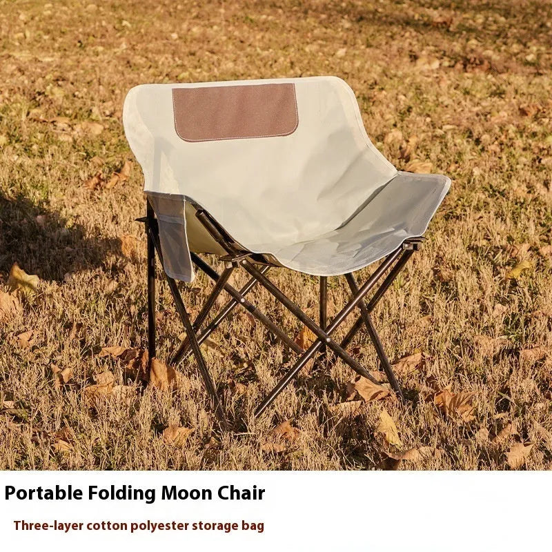 Folding outdoor chair with steel frame and Oxford cloth seat in a neutral colour.