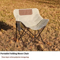 Folding outdoor chair with steel frame and Oxford cloth seat in a neutral colour.