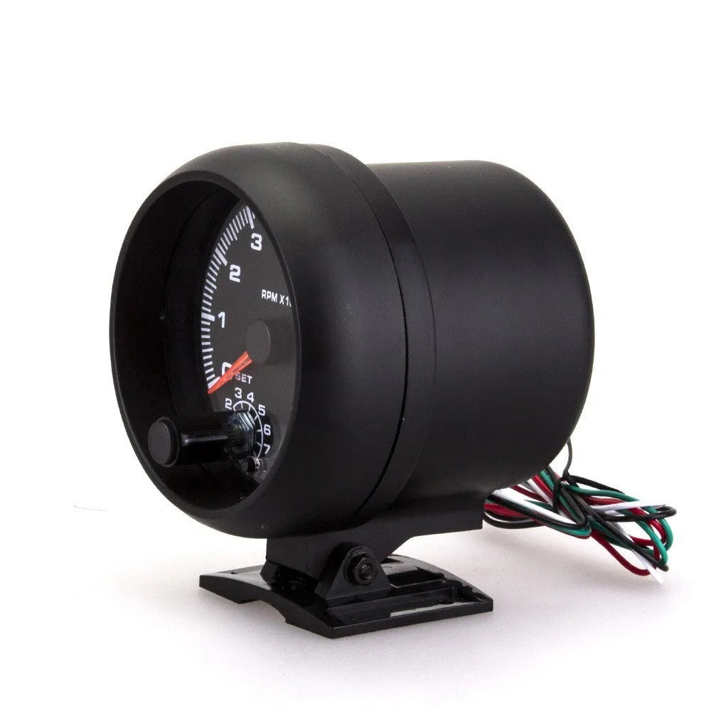 Black plastic automotive tachometer with blue indicator light for engine RPM measurement.
