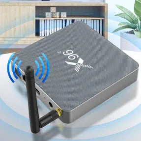 Smart Voice Set-top Box with remote, HDMI cable, and power adapter on a table.