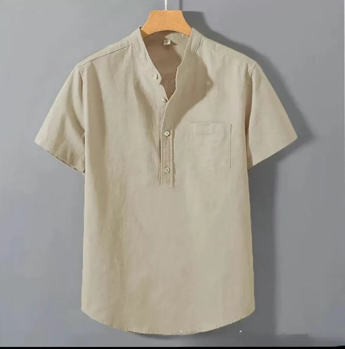 Men's beige casual linen shirt with stand collar and short sleeves on a hanger.