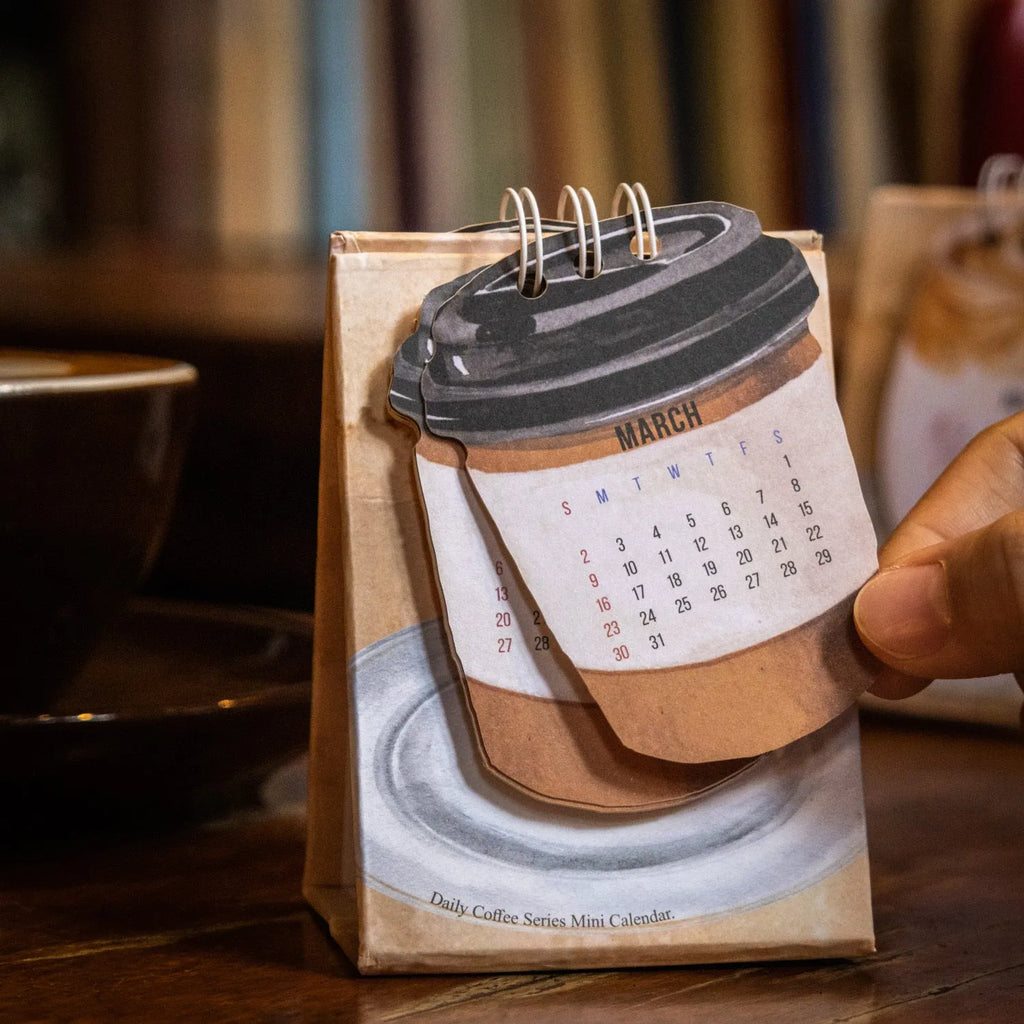 Mini paper desk calendar for 2025 with simple modern design and themed options
