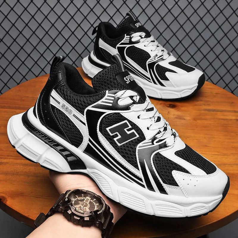 Men's black mesh casual running shoe with round toe and plastic sole