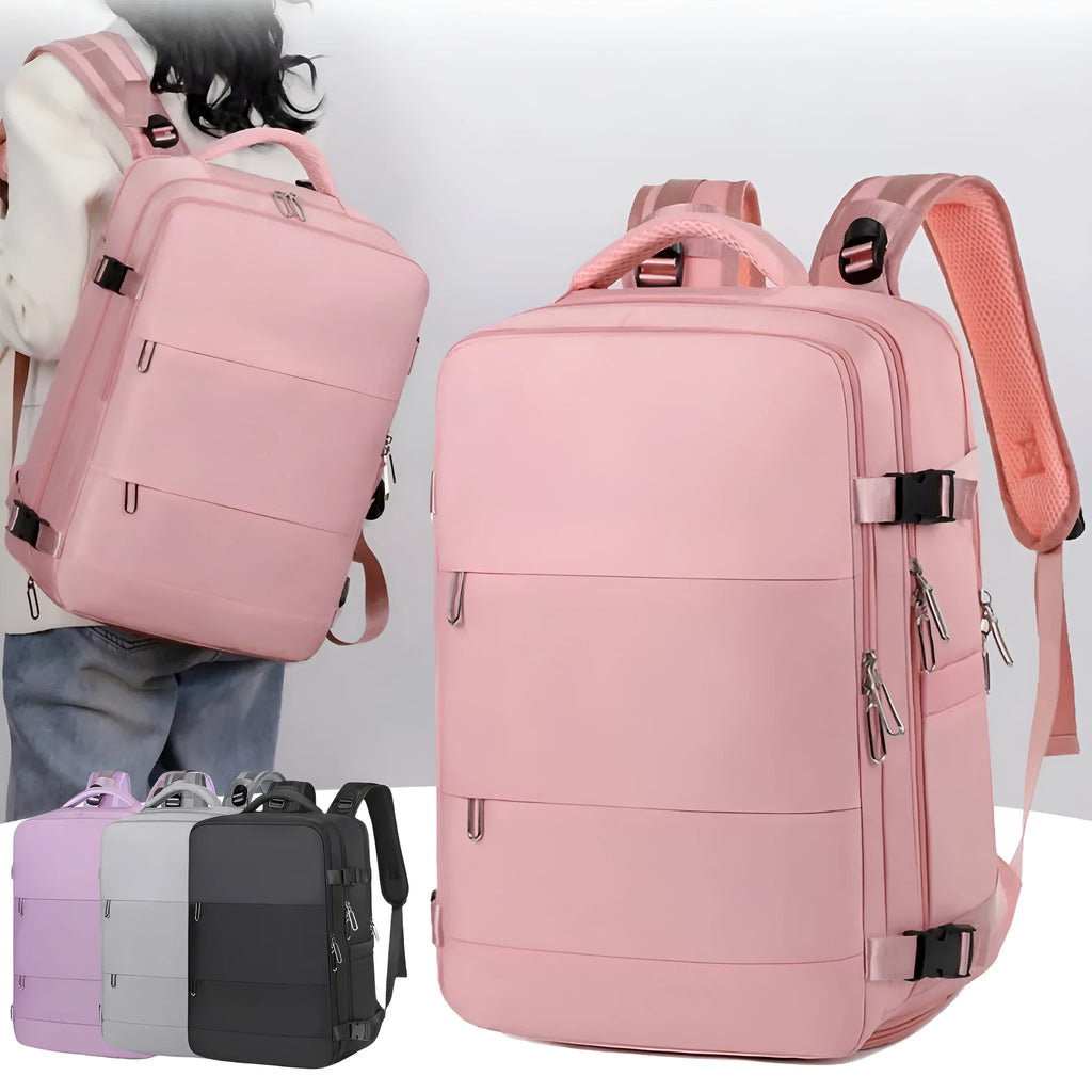 Large purple travel backpack with multiple compartments, shown next to a laptop.