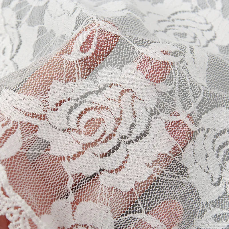 Round black and white floral wedding veil head accessory measuring 30cm.