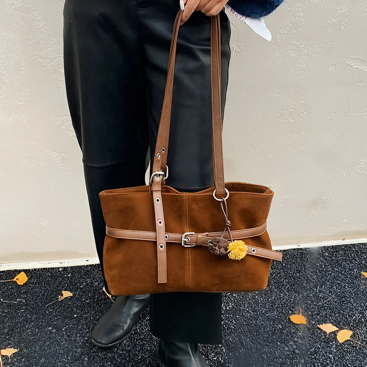 One-shoulder underarm tote bag in PU with polyester lining, zip coin pocket, and splicing detail.