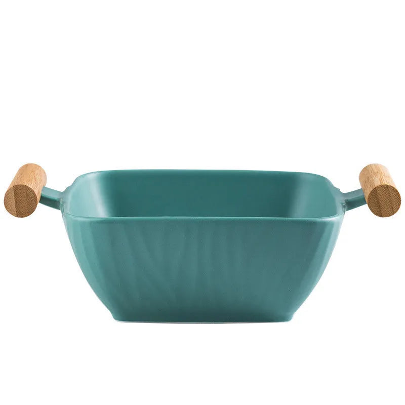 Irregular shaped ceramic bowl with matching lid in porcelain, shown in available colour options