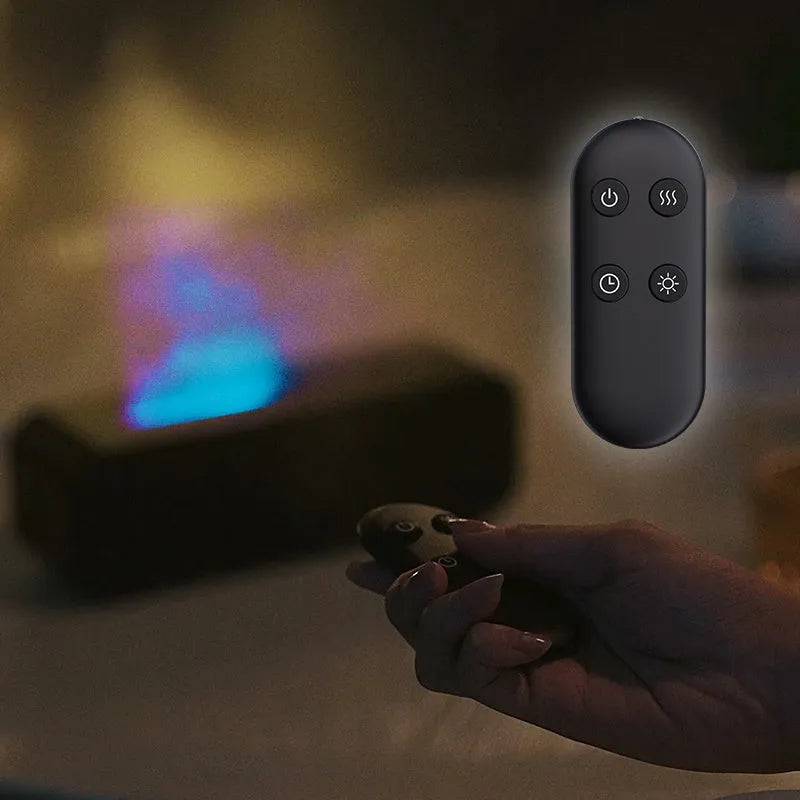 Black cylindrical aroma diffuser with colour-changing LED lights and remote control