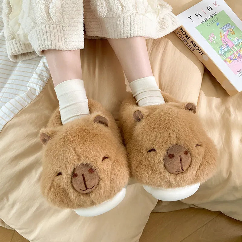 Light brown women's winter slippers with plush upper, artificial wool lining, and slip-on design