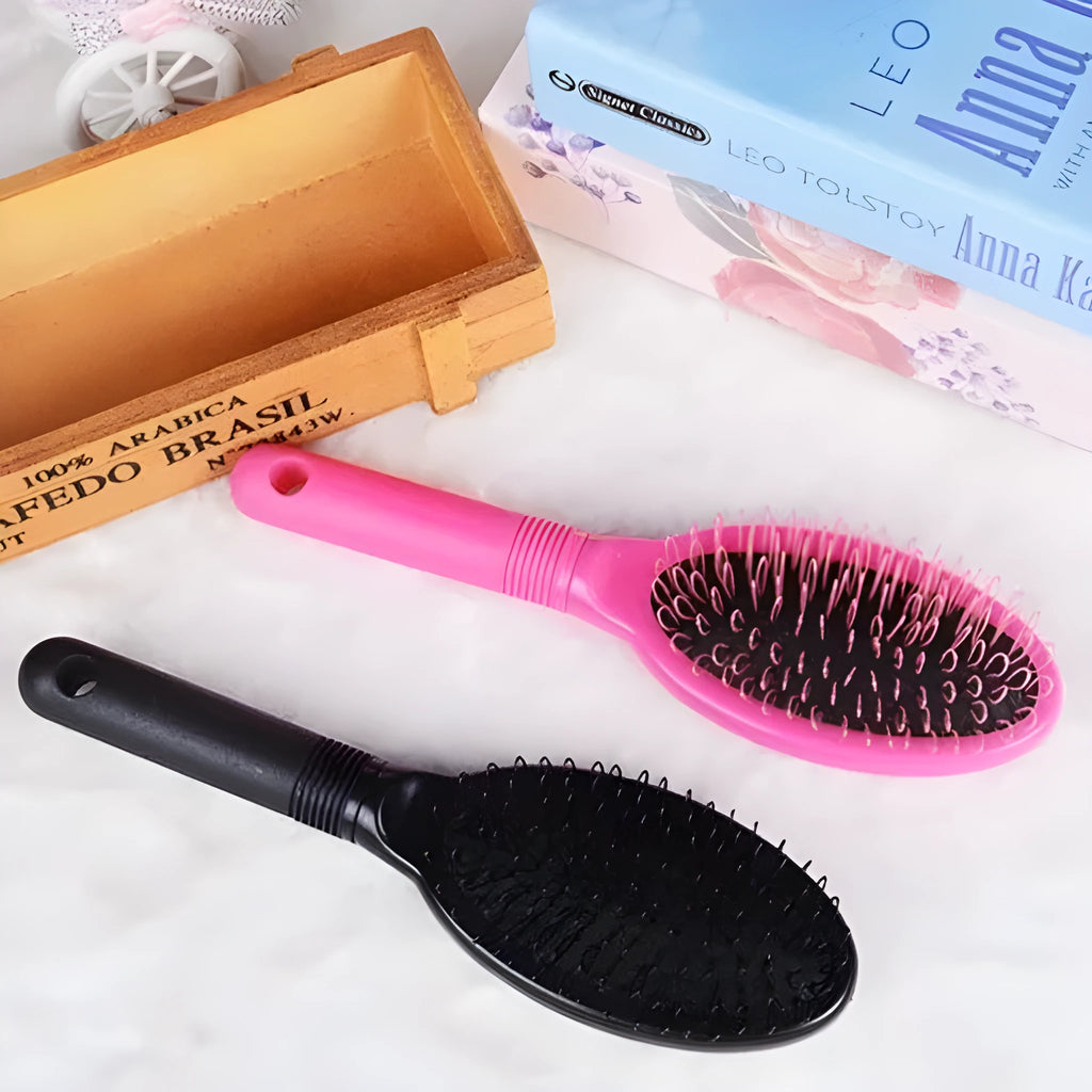 Black or pink plastic ring tooth hair extension comb measuring 22cm long