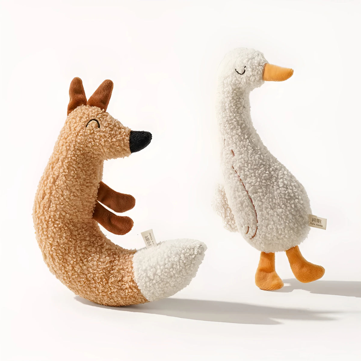 Soft plush dog toy in fox or duckling design with bite-resistant construction.