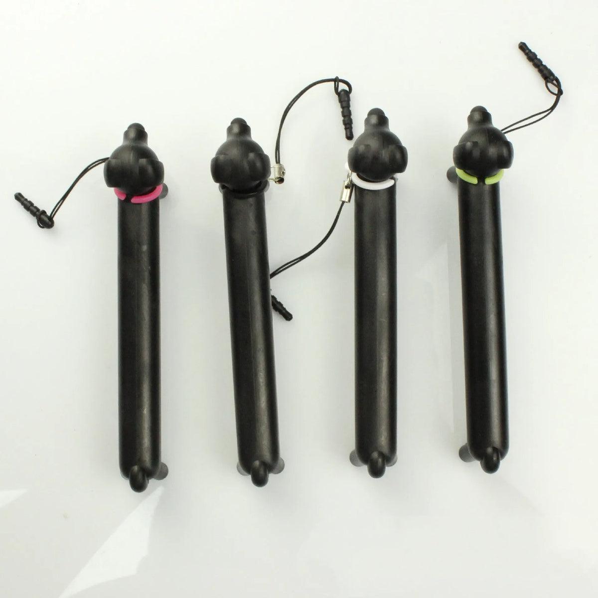 Black dog shaped touch screen stylus showing adjustable length design and phone stand conversion