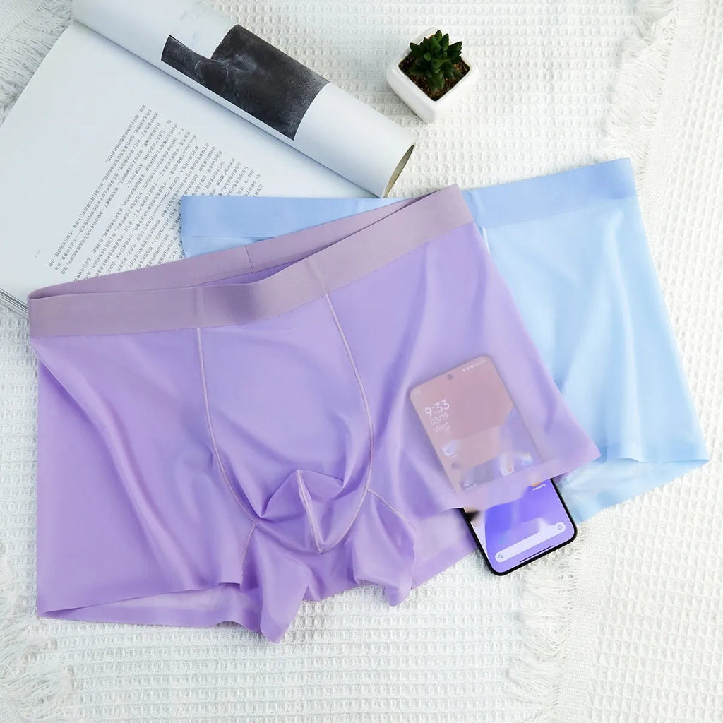 Men's ice silk boxer briefs in seamless traceless design showing white, purple, pink, sky blue and black colour options