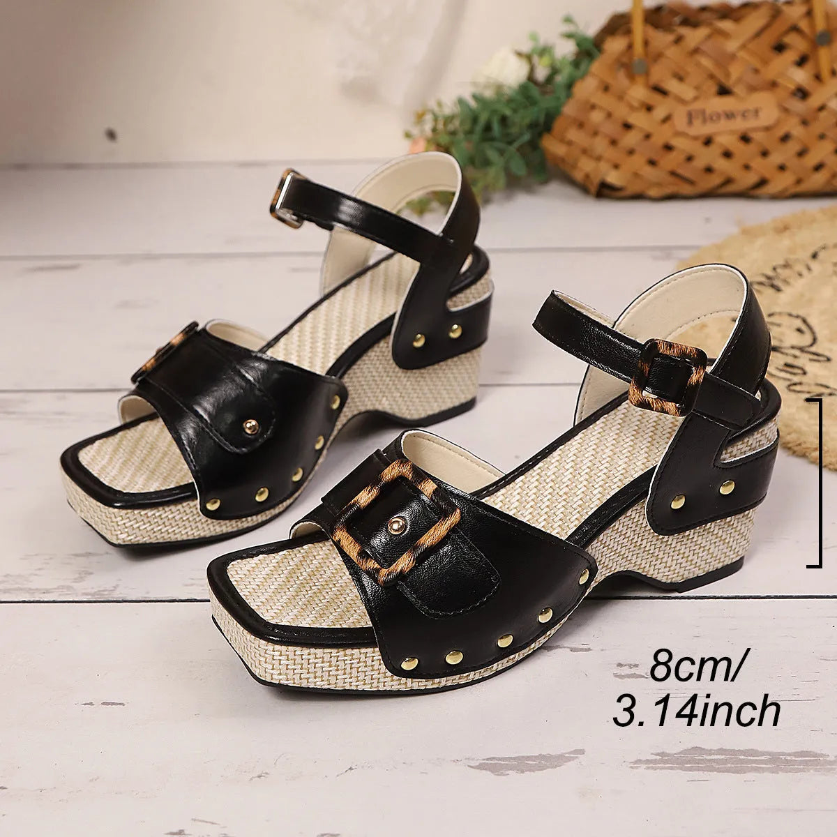 Women's black chunky heel sandals with metal buckle and square toe design on rubber sole