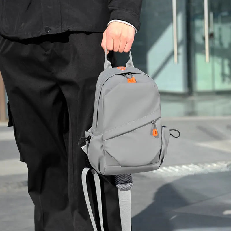 Men's waterproof polyester casual crossbody bag in black with single shoulder strap