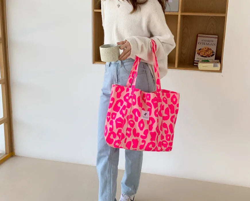 Women's large Oxford cloth shoulder bag with a three-dimensional front pocket in black, pink, blue, or multicolour.