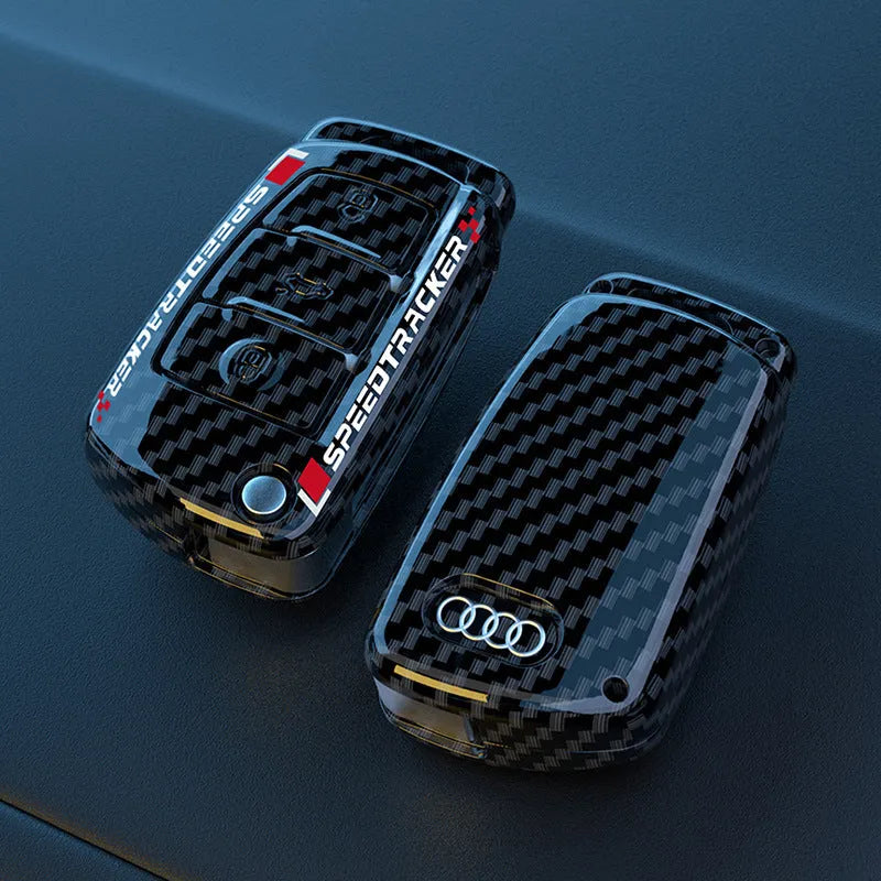 Carbon fibre pattern car key cover with mirrored surface elements in carbon black colour