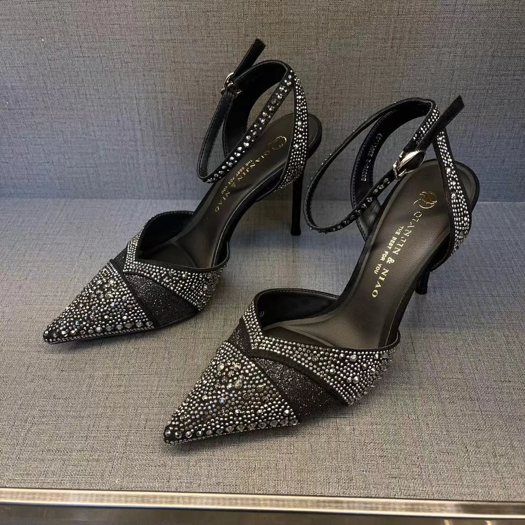 Women's black hollow high heels with stiletto heel, pointed toe, and red sole