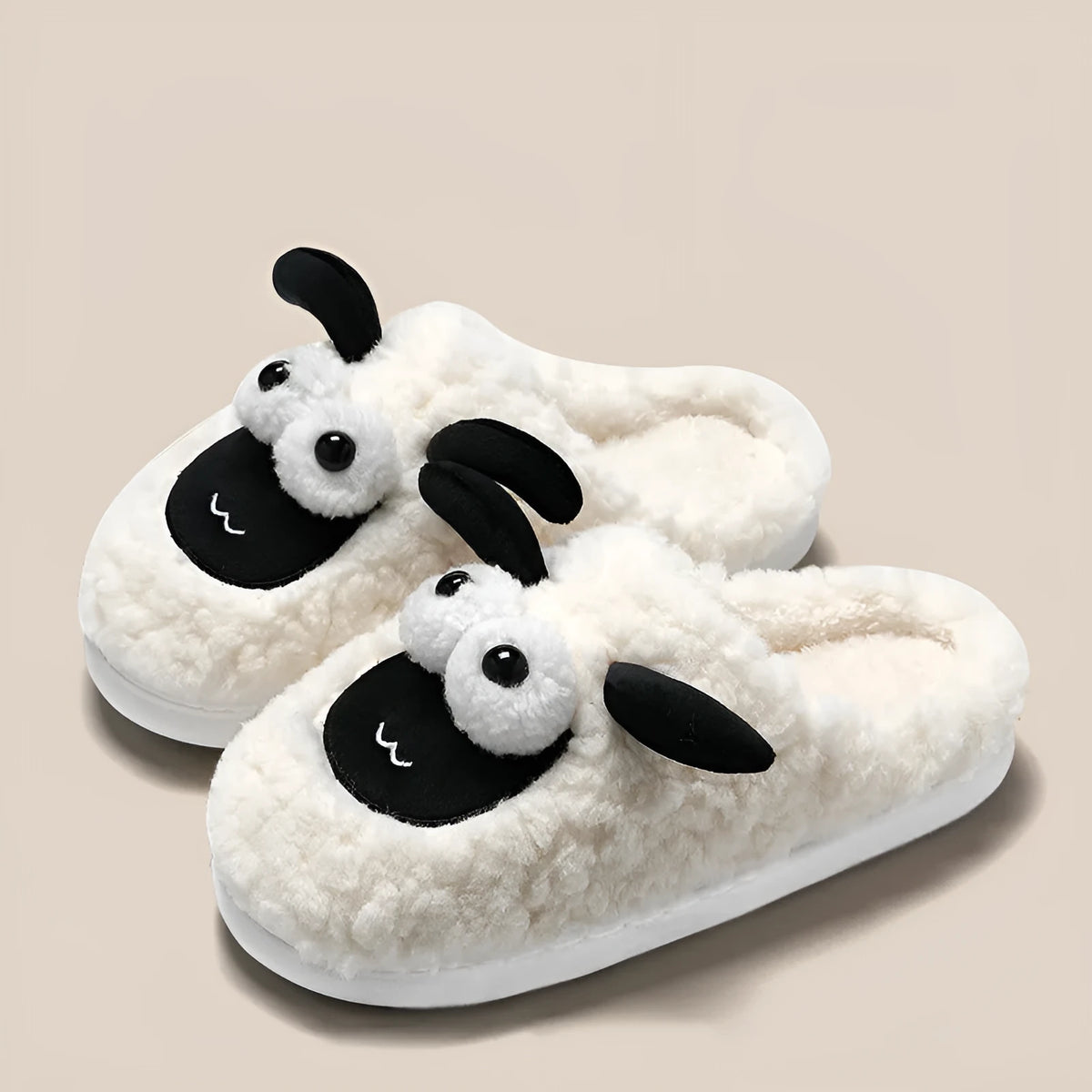 Brown suede slip-on slippers with thermal lining on a wooden floor