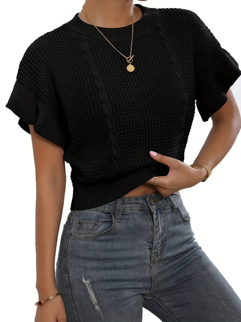 Knitted pullover sweater with ruffled short sleeves and twisted string detail in a loose fit.