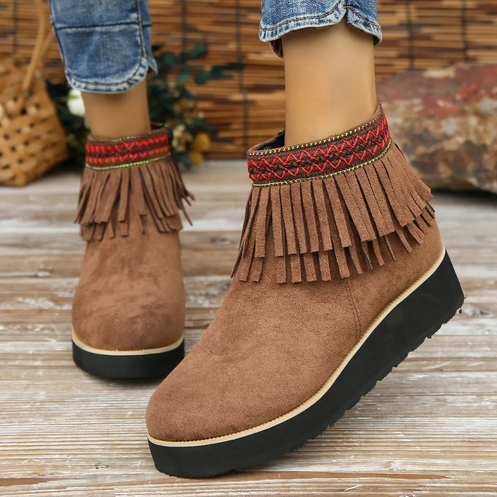 Women's dark brown suede wedge ankle boots with side zip, waterproof platform, and tassel detail.