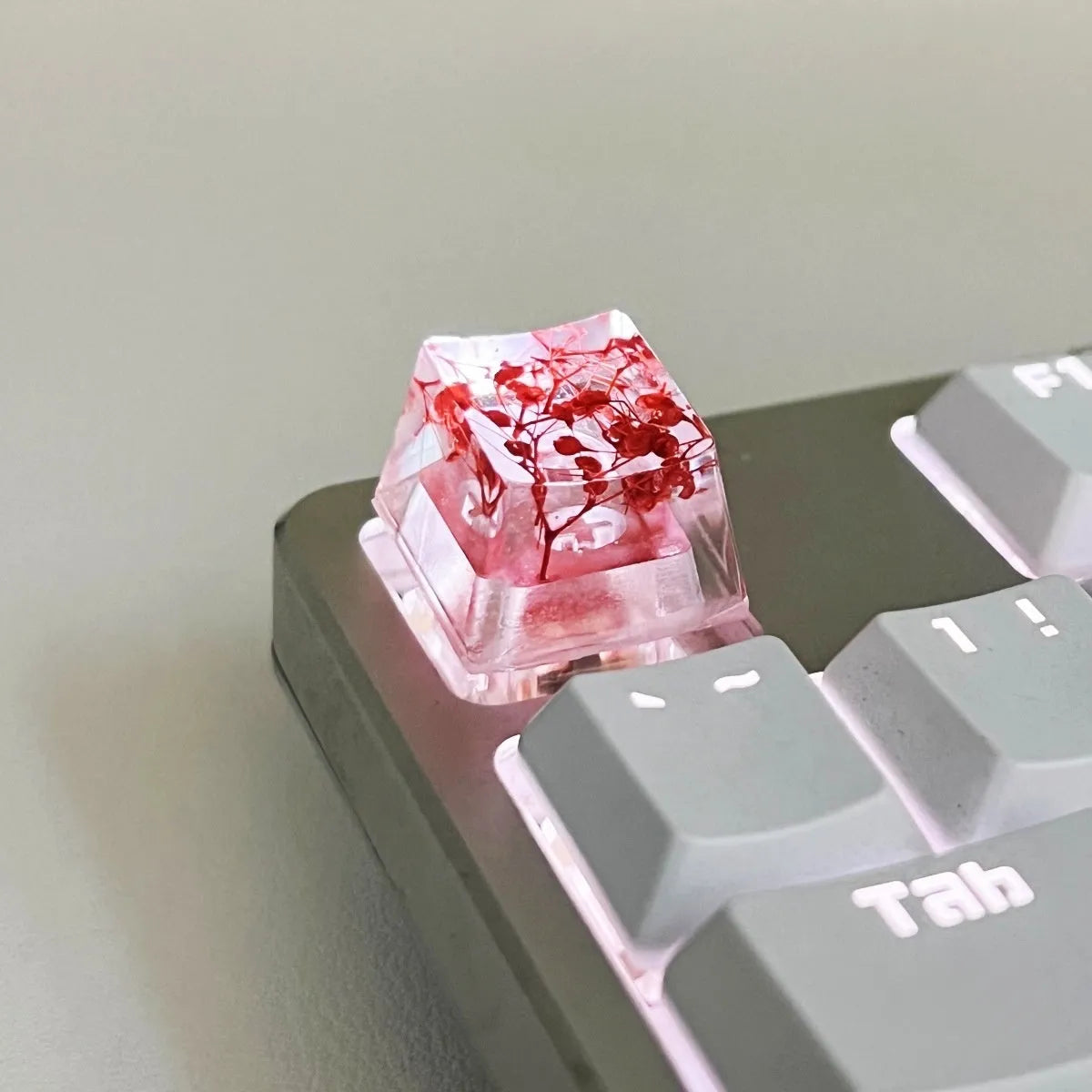 Clear resin mechanical keyboard keycap with starry sky design in green.