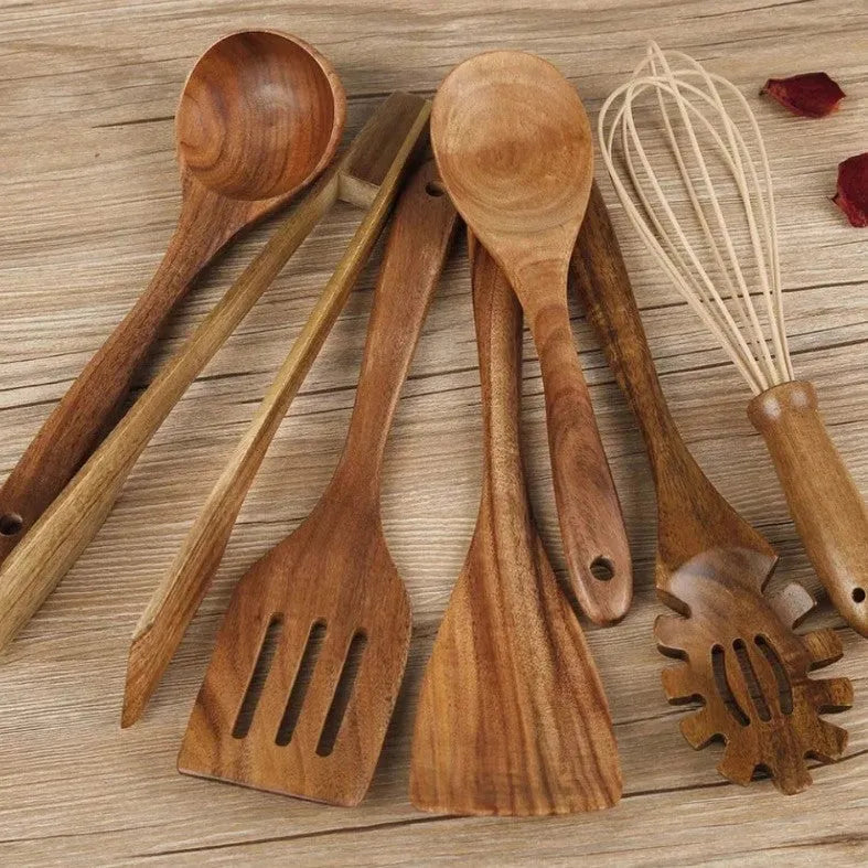 Premium wooden cooking utensils seven-piece set including spoon and spatula on kitchen counter