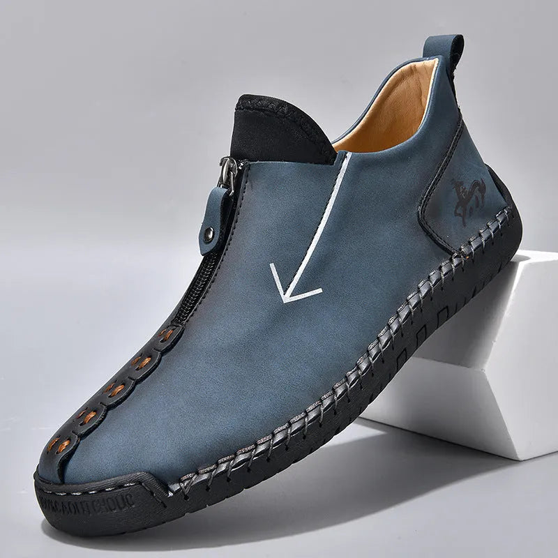 Men's black casual Martin boots with a front zip, round toe, and low rubber sole.
