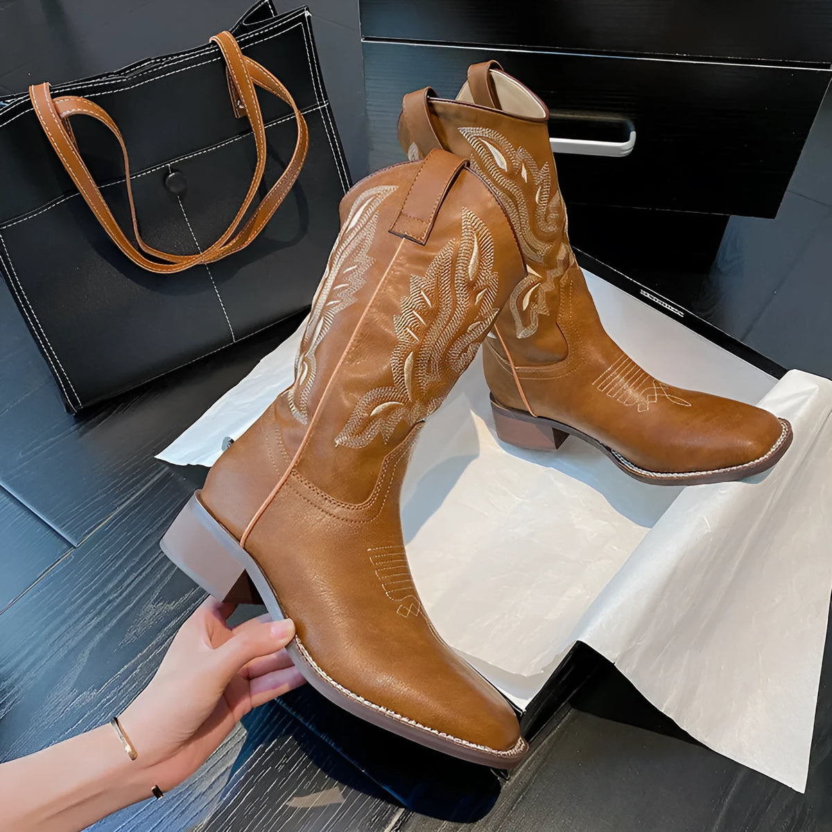 Brown women's mid-calf lace-up Martin boots with embroidered pattern on the upper.