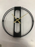 Round metal wall clock with 50cm diameter face in black or gold colour on white wall